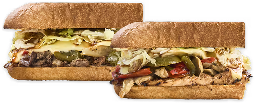 two sandwiches that look very tasty. melted cheese is overflowing. the ingredients look fresh. 